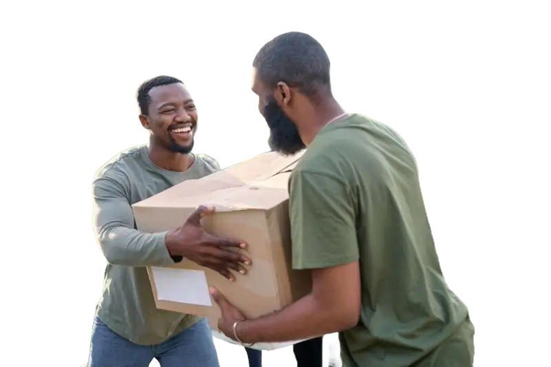 A man smiling and handing a box to another man.